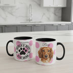 Two mugs with personalized designs on a kitchen counter.